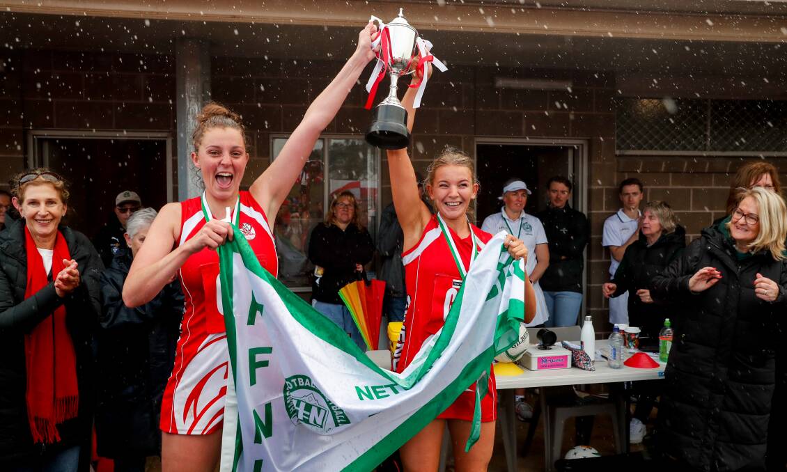 South co-captains Annie Blackburn and Carly Watson hoist last year's breakthrough open grade premiership. Picture by Rob Gunstone