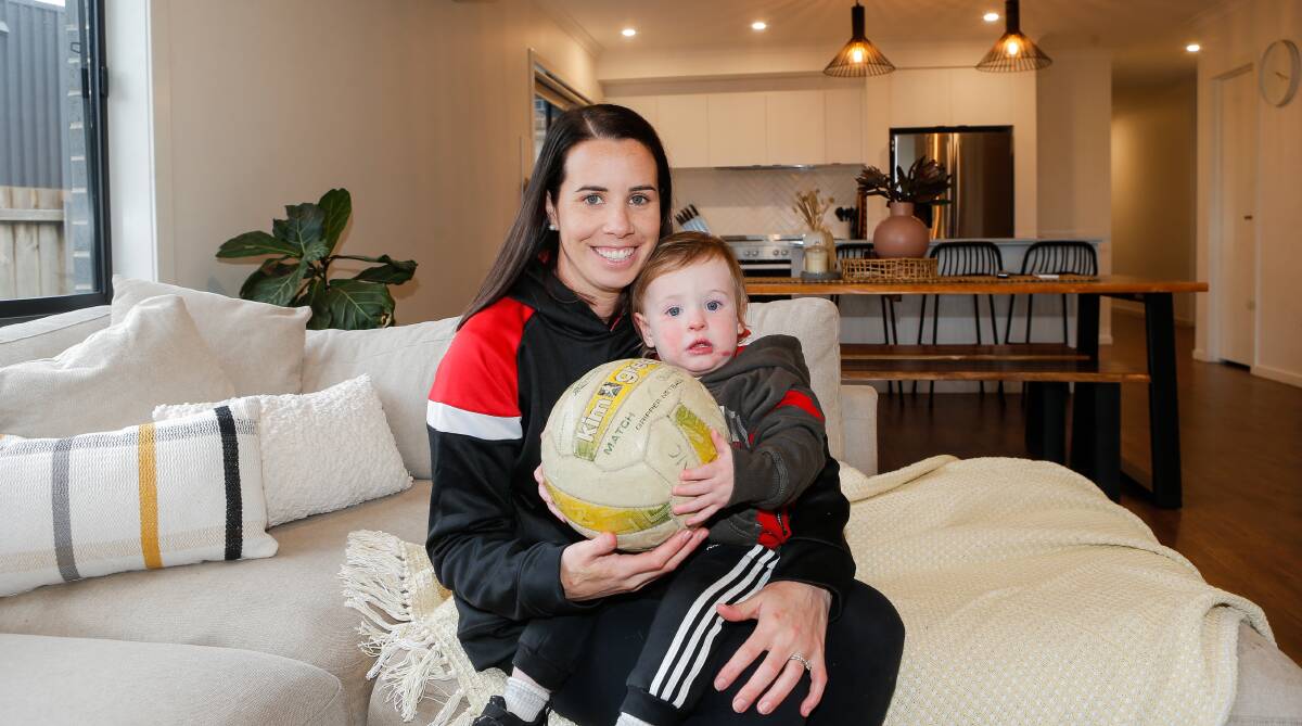 Emily-Rose Dobson, pictured with son Freddie, co-captained Koroit's open netball team in 2022. She also celebrated 100 club games. Picture by Anthony Brady