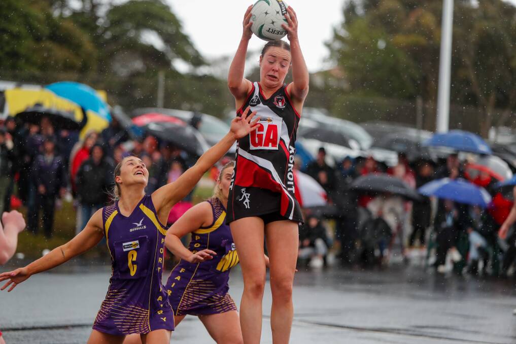 Meg Carlin leaps for the ball in the 2022 Hampden league division one grand final. 