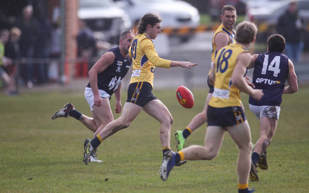 SILKY: North Warrnambool's Bailey Jenkinson floods forward with the ball. Picture: Morgan Hancock