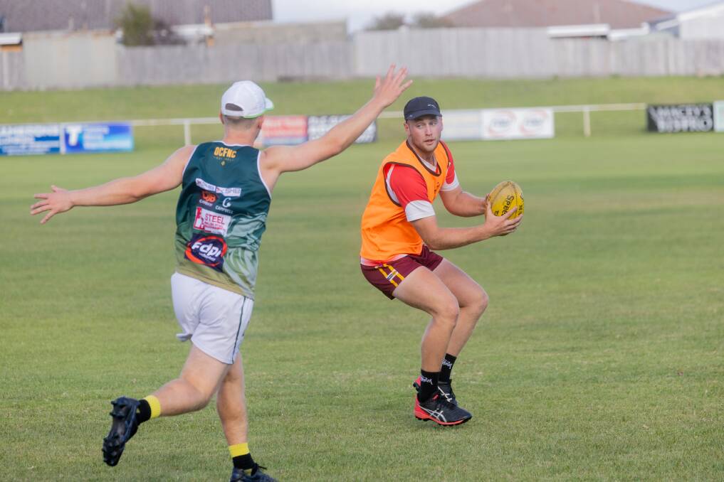 New recruit Jackson Creed evades an opponent in a training drill. Picture by Anthony Brady