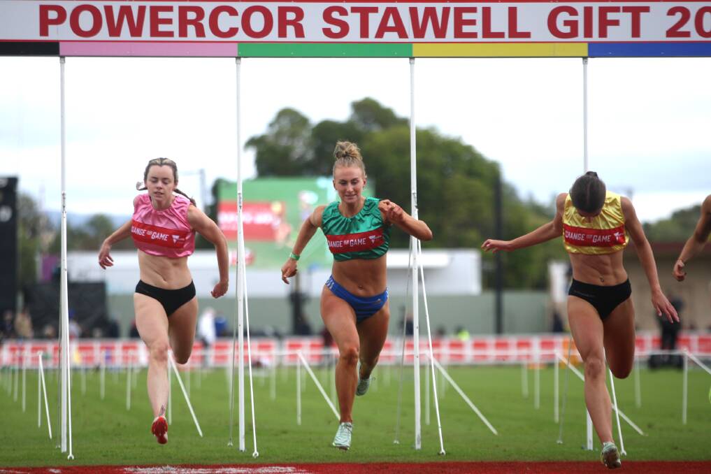 Grassmere's Layla Watson crosses the finish line in the women's Stawell Gift final, with Bella Pasquali (right) taking out the victory. Picture by Meg Saultry