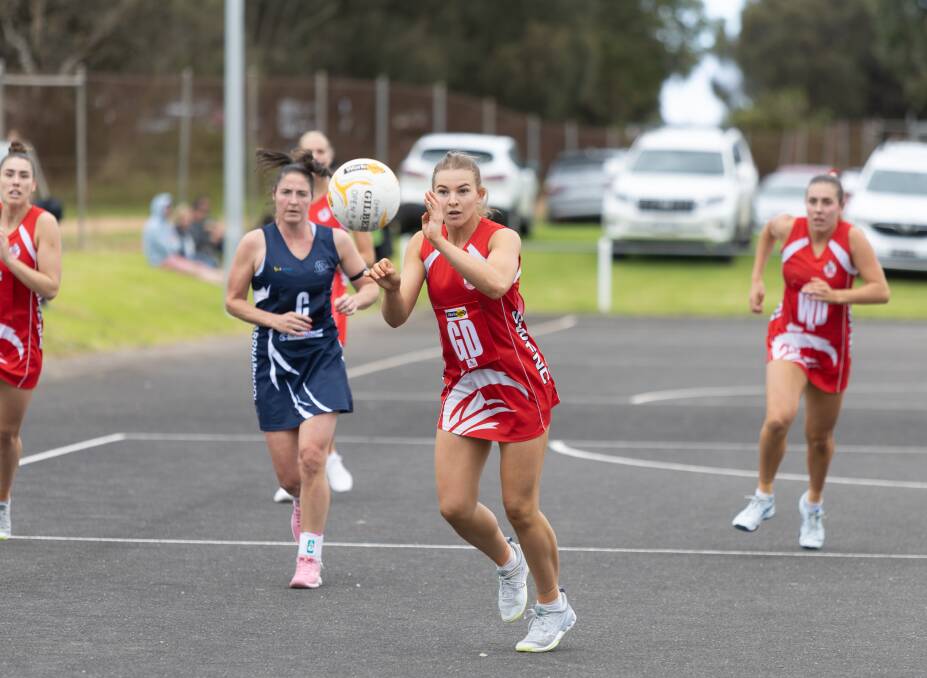 South Warrnambool's Carly Watson rebounds the ball out of the Roosters' defence. Picture by Eddie Guerrero