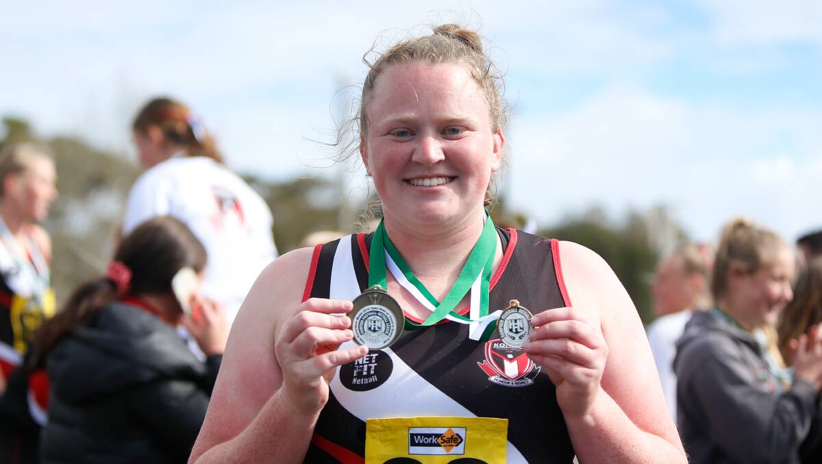 PROUD: Koroit's Nell Mitchell with her Hampden league open premiership medal and best on court medal in 2019.