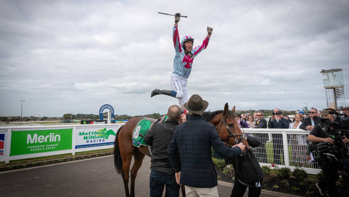 Jockey Chris McCarthy jumps from Rockstar Ronnie after winning the Grand Annual Steeplechase. Picture by Sean McKenna.