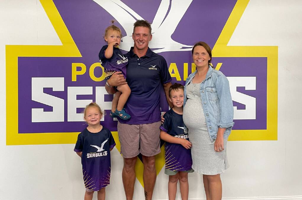 Port Fairy recruit Jason Rowan with wife Bec and children Daisy, 3, Myla, 1, and Freddie, 5, in their new club colours. Picture supplied.