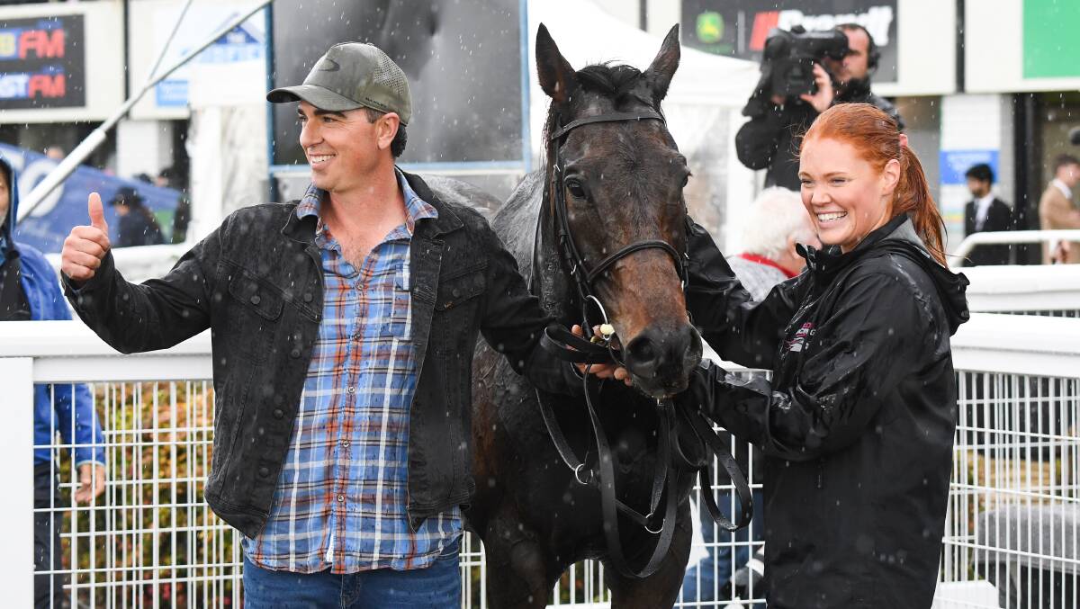 Warrnambool trainer Symon Wilde and Micah Drake with Britannicus after winning the 3YB FM Scotty Stewart Brierly Steeplechase on Tuesday afternoon. Picture by Racing Photos