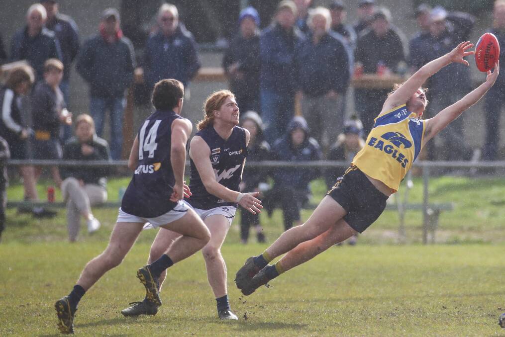 BRILLIANT: Jack Burke takes a giant grab in a break out performance for the North Warrnambool forward. Picture: Morgan Hancock