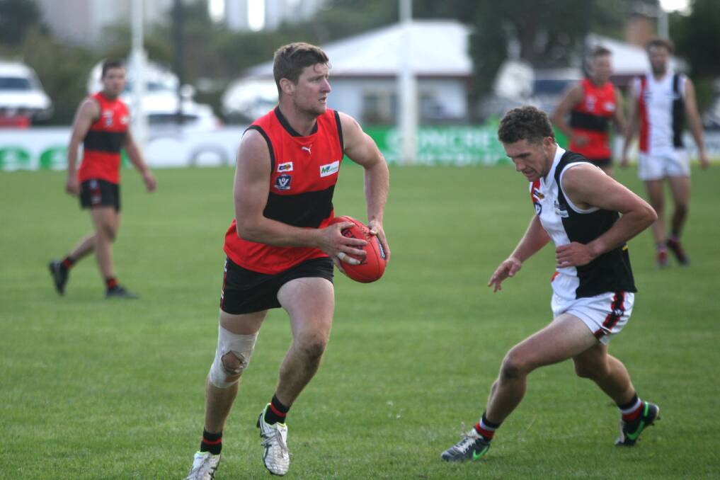 Cobden co-captain Jack Hutt charges forward with the Sherrin. Picture by Meg Saultry