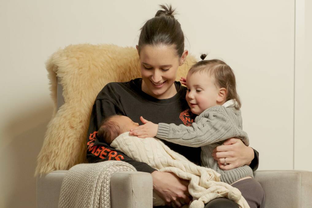 Cobden coach Sophie Hinkley with her daughters Annabel, four days, and Holly, 2. Picture by Chris Doheny