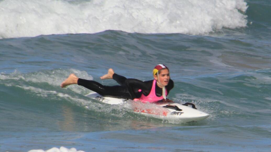 Molly McNeil rides her board into shore. Picture supplied/George El-Hage