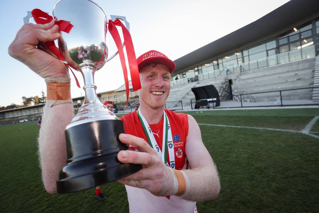 South Warrnambool's Harry Lee with the premiership cup. Picture by Sean McKenna