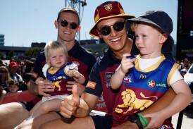Hugh McCluggage (pictured second from right alongside Ryan Lester and his children Georgie and Romeo) during the 2023 AFL grand final parade on Friday. Picture by Getty Images