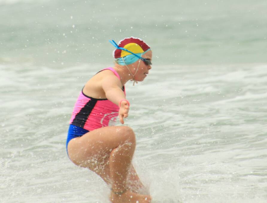 Hannah Ragg dives into the ocean during competition. Picture supplied/George El-Hage