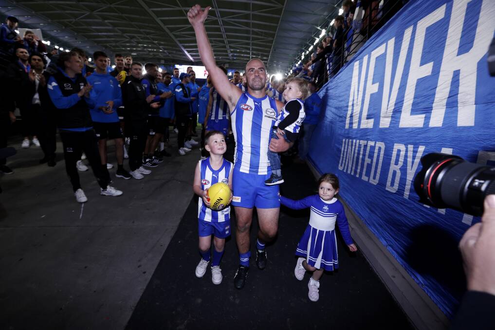 Ben Cunnington, pictured with his children Xavier, Stella and Kobe after his final AFL appearance, is excited about the next chapter in Warrnambool and the Hampden league. Picture by Getty Images