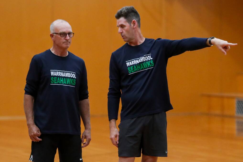 John Wormald (left), pictured in 2020 coaching CBL, was inducted as a life member of Warrnambool Basketball following more than two decades of coaching roles. 