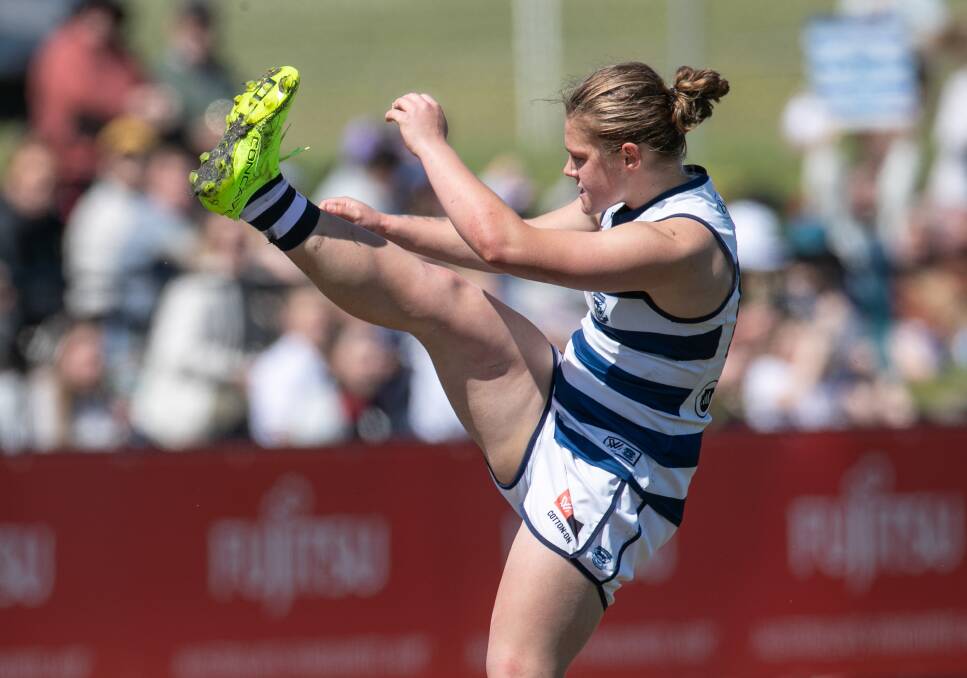 Geelong's Chloe Scheer kicks one of her three goals for the day. Pictures by Sean McKenna