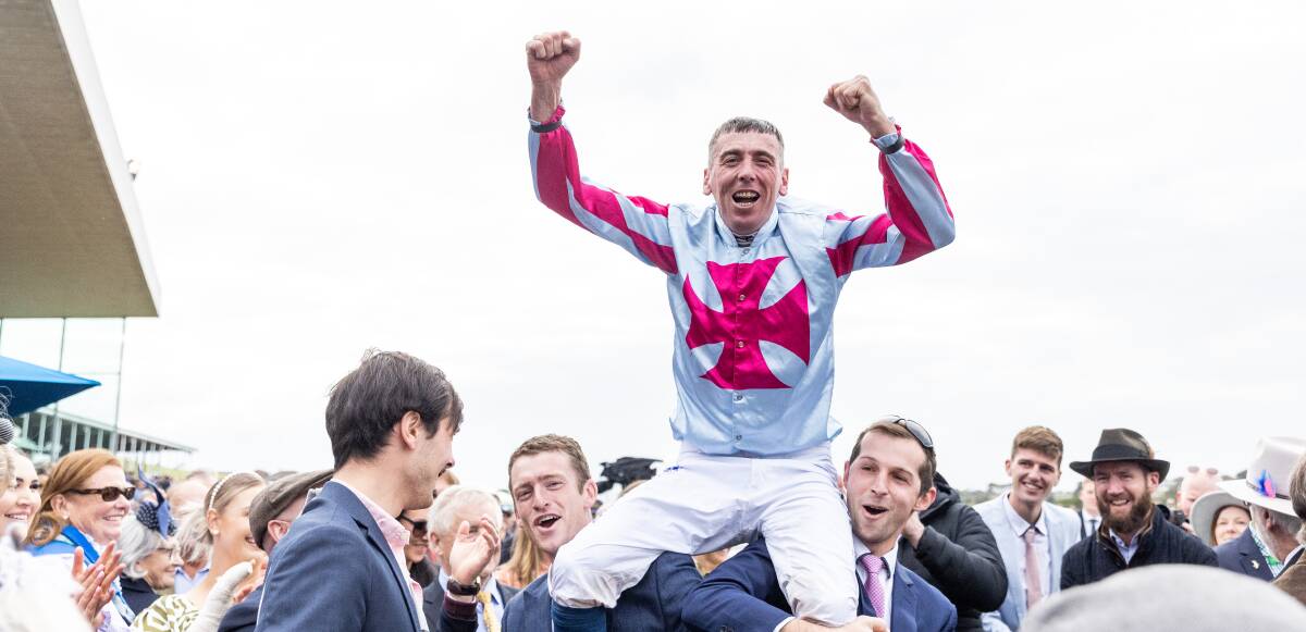 Winning jockey Chris McCarthy celebrates after winning his first Grand Annual Steeplechase on day three of the May Racing Carnival. Picture by Anthony Brady