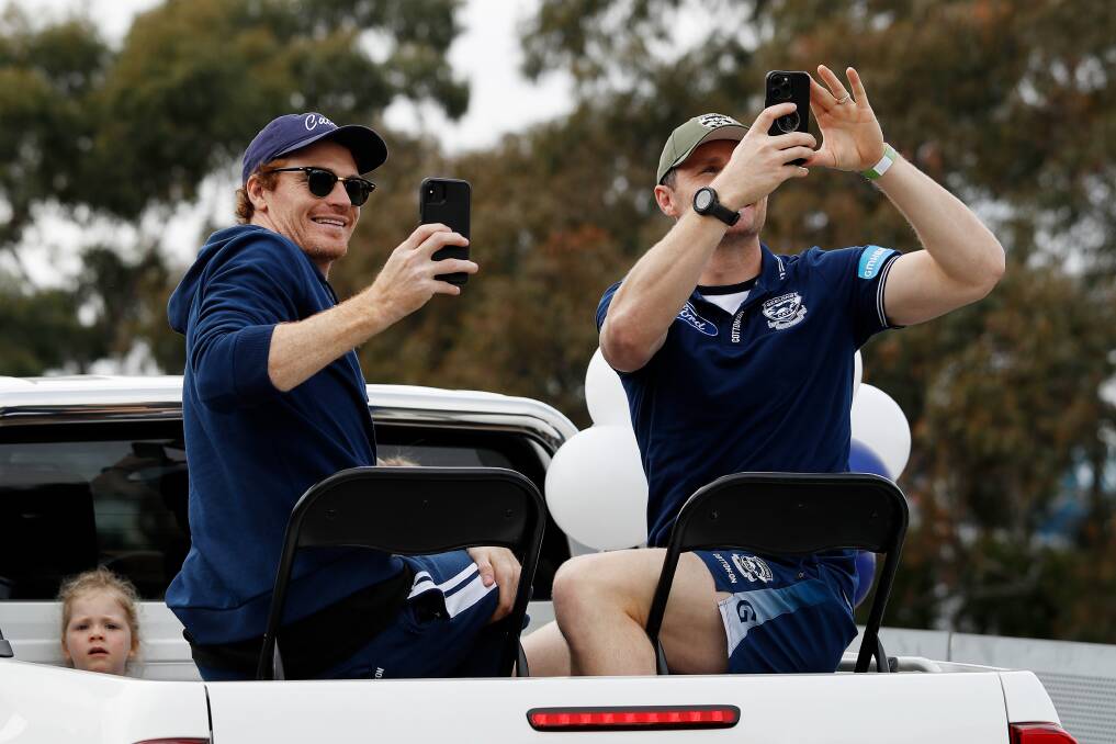 Cobden's Gary Rohan (left) takes part in Friday's AFL grand final parade. Picture by Getty Images