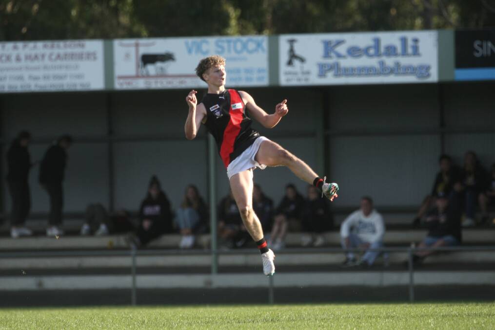 Rhys Unwin hangs in the air after firing off a long-shot attempt on goal for Cobden in 2023. Picture by Meg Saultry
