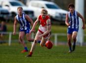 LOCKED IN: South Warrnambool's Ollie Harris chases the Sherrin. Picture: Chris Doheny