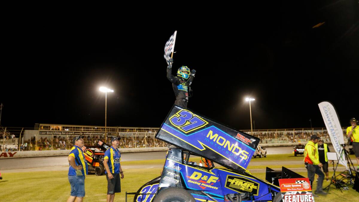 TOP OF THE WORLD: Saturday night feature winner Grant Anderson celebrates his win. Picture: Anthony Brady