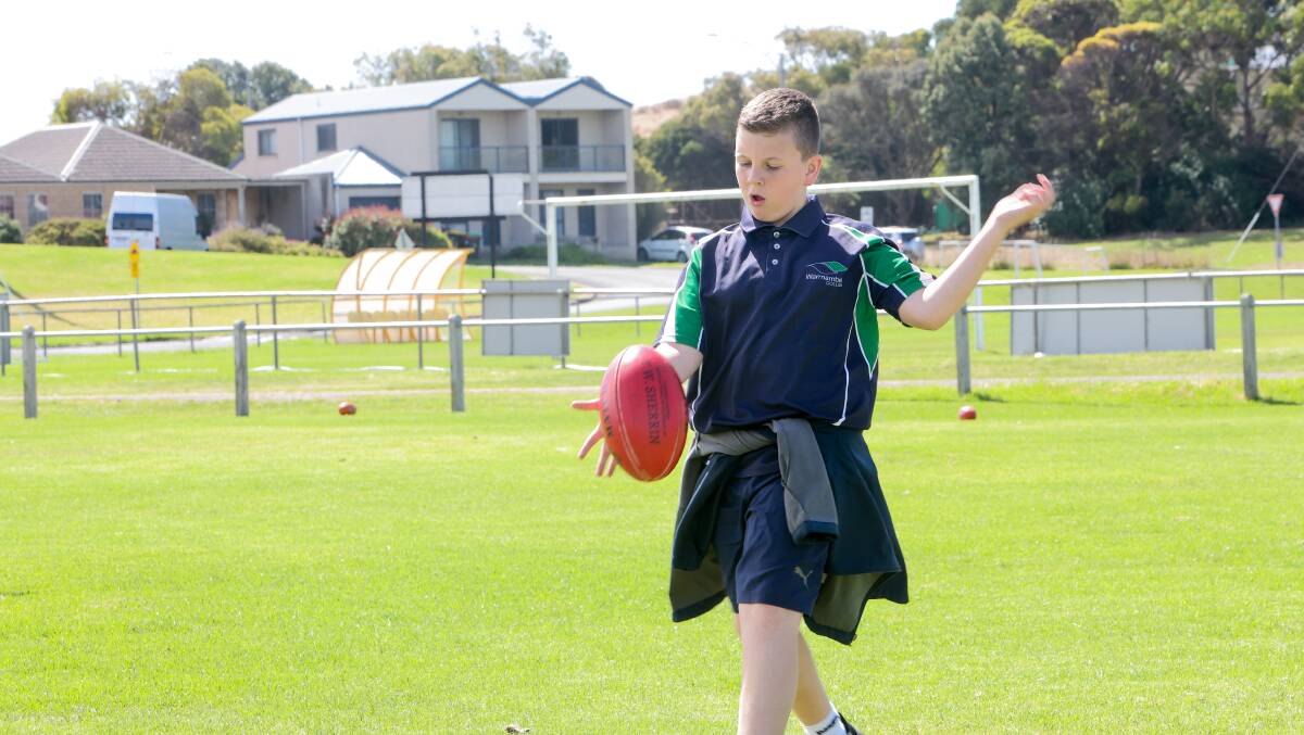 Youngster Cooper McDonald enjoys a kick of the footy at Harris Street Reserve. Picture by Anthony Brady