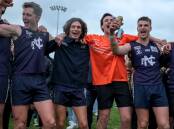 Nirranda skipper James Willsher belts out the song in the middle of Reid Oval after the WDFNL grand final win against Panmure on Saturday. Picture by Chris Doheny