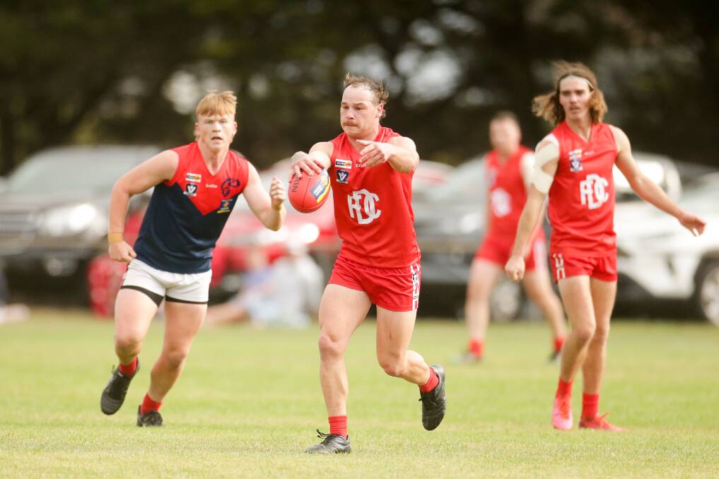 BIG WIN: Dennington skipper Tom Fitzgerald drives the ball into attack for the Dogs on Saturday. Picture: Chris Doheny