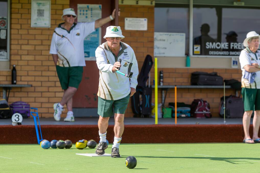 Barry Crispe from Lawn Tennis Green takes his shot in the sunshine at the Koroit Bowls Club. Picture by Eddie Guerrero