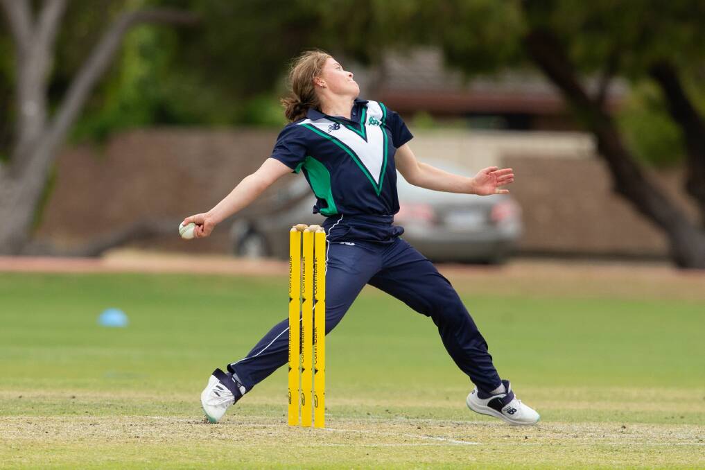 Milly Illingworth bends the back and sends down a delivery for Vic Country. Picture by Cricket Australia