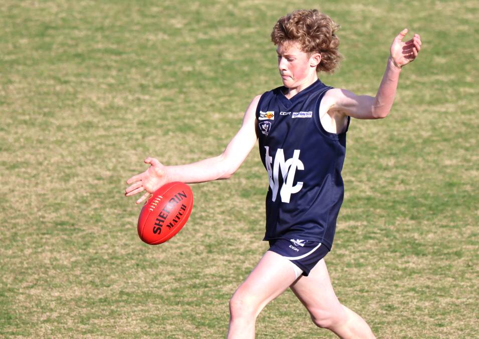 Warrnambool's Riley Holloway kicks the ball in the under 16 grand final. Picture by Justine McCullagh-Beasy