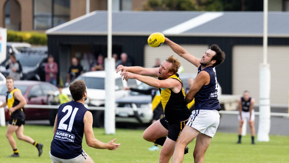 Manny Sandow and Mathew Lloyd compete for the footy at Merrivale. Pictures by Anthony Brady