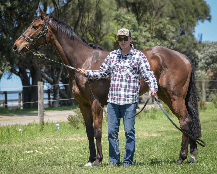 Warrnambool trainer Symon Wilde at his stables with Tralee Rose. Picture by Sean McKenna