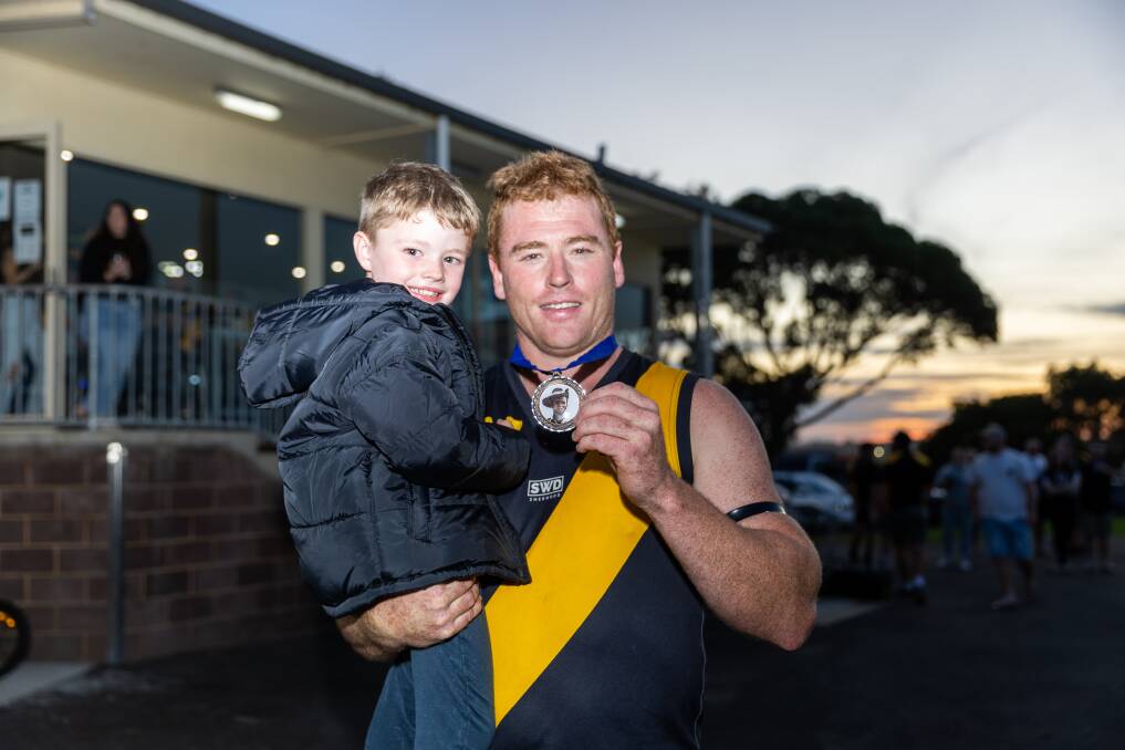 Portland Tigers star Jake Wilson and son Tomy show off the Anzac Day Medal. Picture by Eddie Guerrero