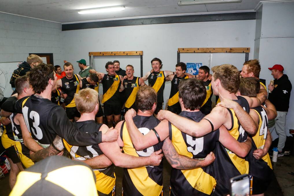 PROUD: Merrivale sings its song in the rooms after the impressive WDFNL elimination final win. Picture: Anthony Brady
