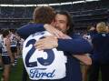 Emotions run high as Gary Rohan embraces Cats coach Chris Scott after the match. Pictures by Getty Images