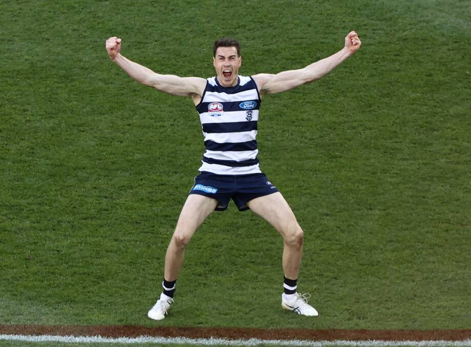Jeremy Cameron turns to the Geelong faithful after slotting one from the paint of 50. Picture by Getty Images