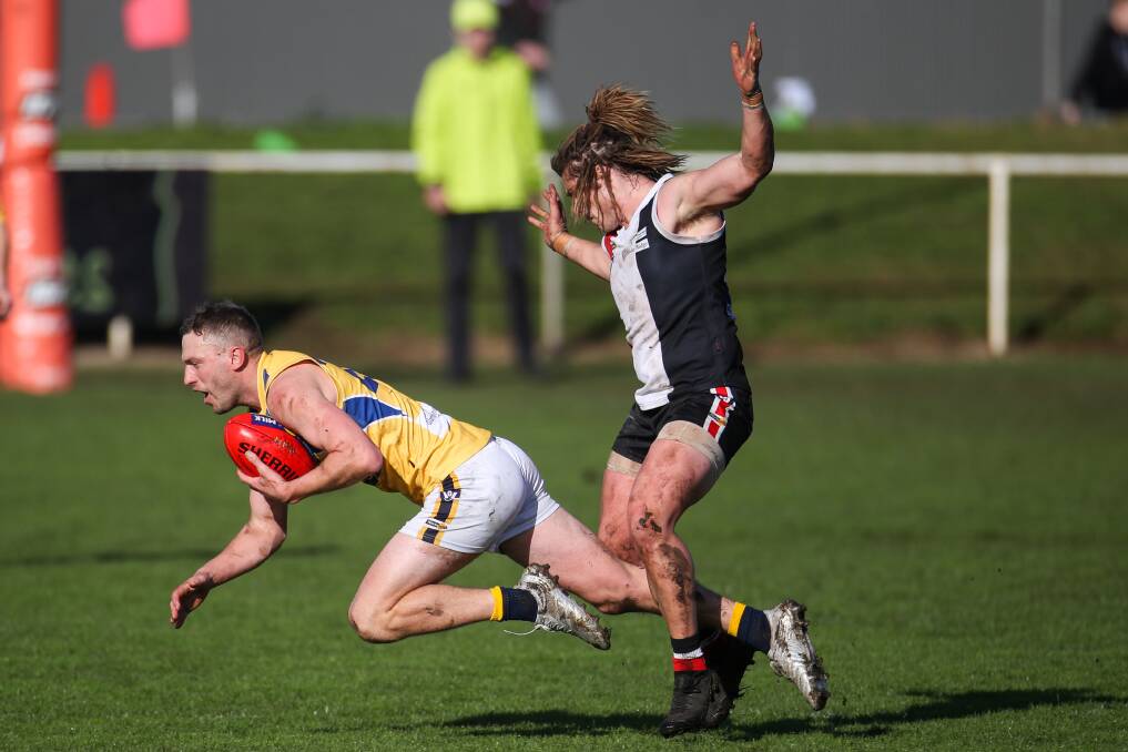 ABSORBING BATTLE: Billie Smedts completes a mark for North Warrnambool Eagles on Saturday. Picture: Morgan Hancock