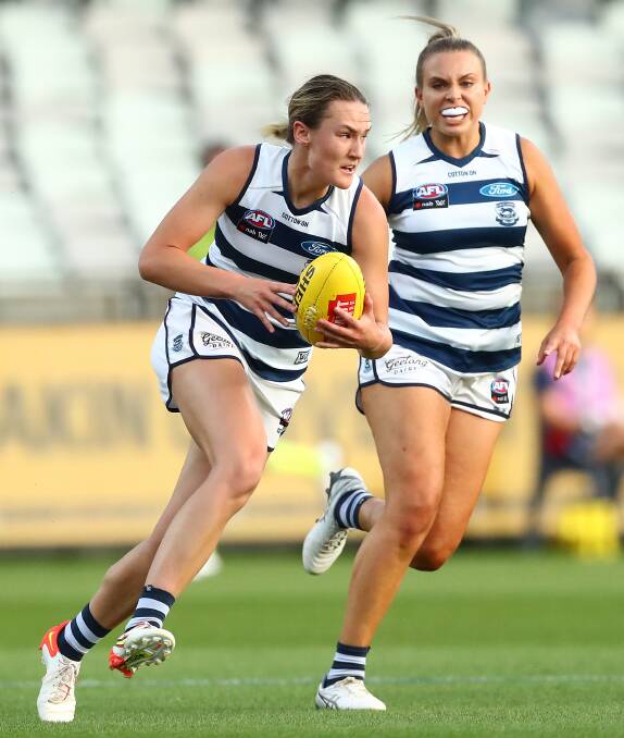 Georgia Clarke breaks away with the football during a match for Geelong. Picture by Getty Images