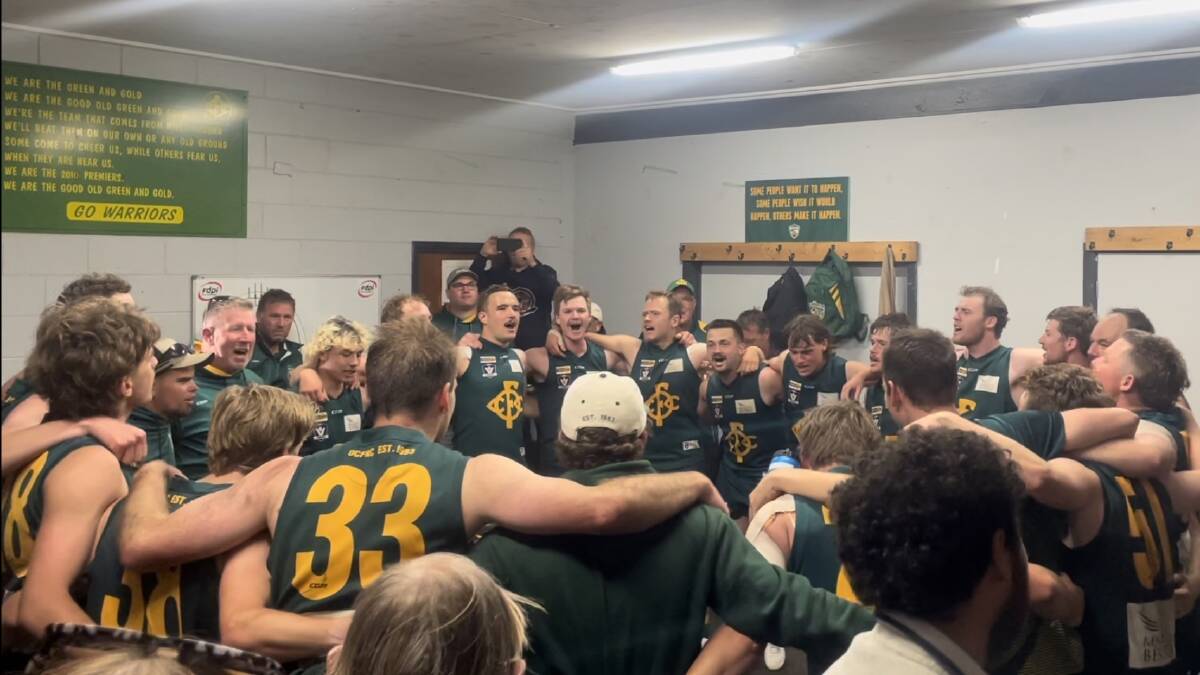 Old Collegians belt out the song after winning for the first time in almost two years. Pictures by Nick Creely
