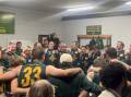 Old Collegians belt out the song after winning for the first time in almost two years. Pictures by Nick Creely