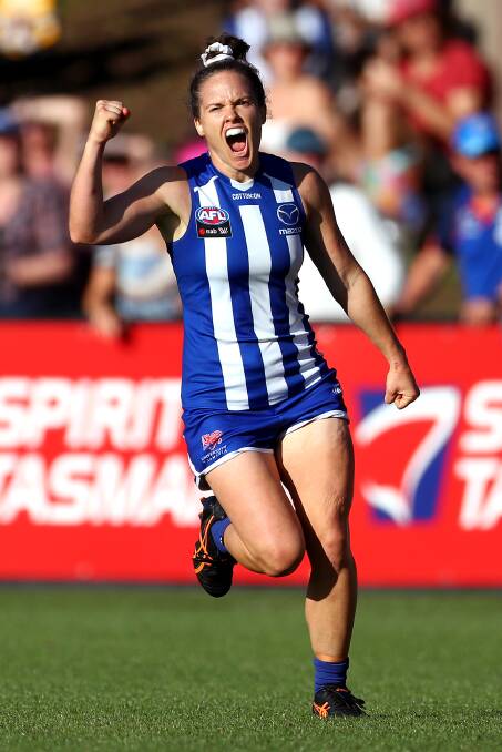 HAPPY SKIPPER: Kearney celebrates a goal for North Melbourne. Picture: Getty Images