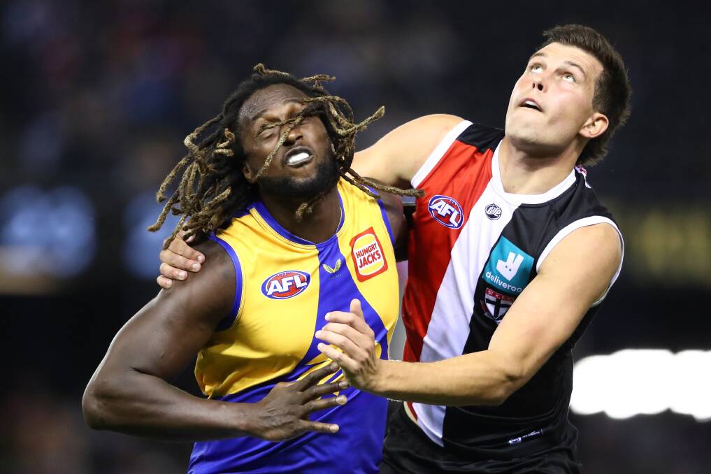 FOCUSED: Marshall contests the ruck against West Coast superstar Nic Naitanui last year. Picture: Getty Images