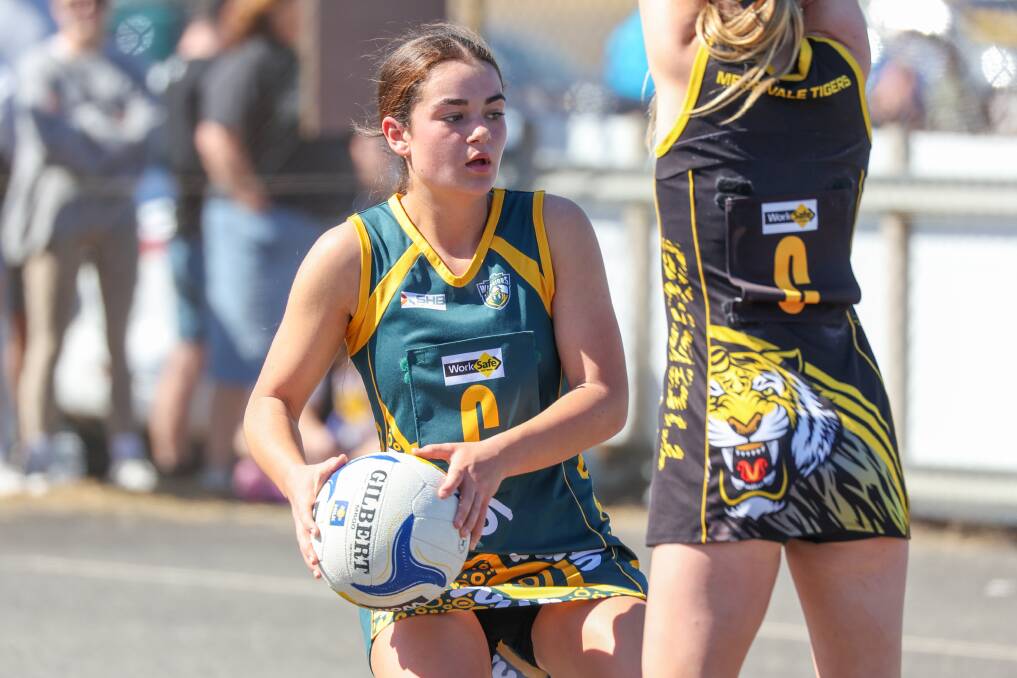 Old Collegians' Annabel Lucas with possession against Merrivale.