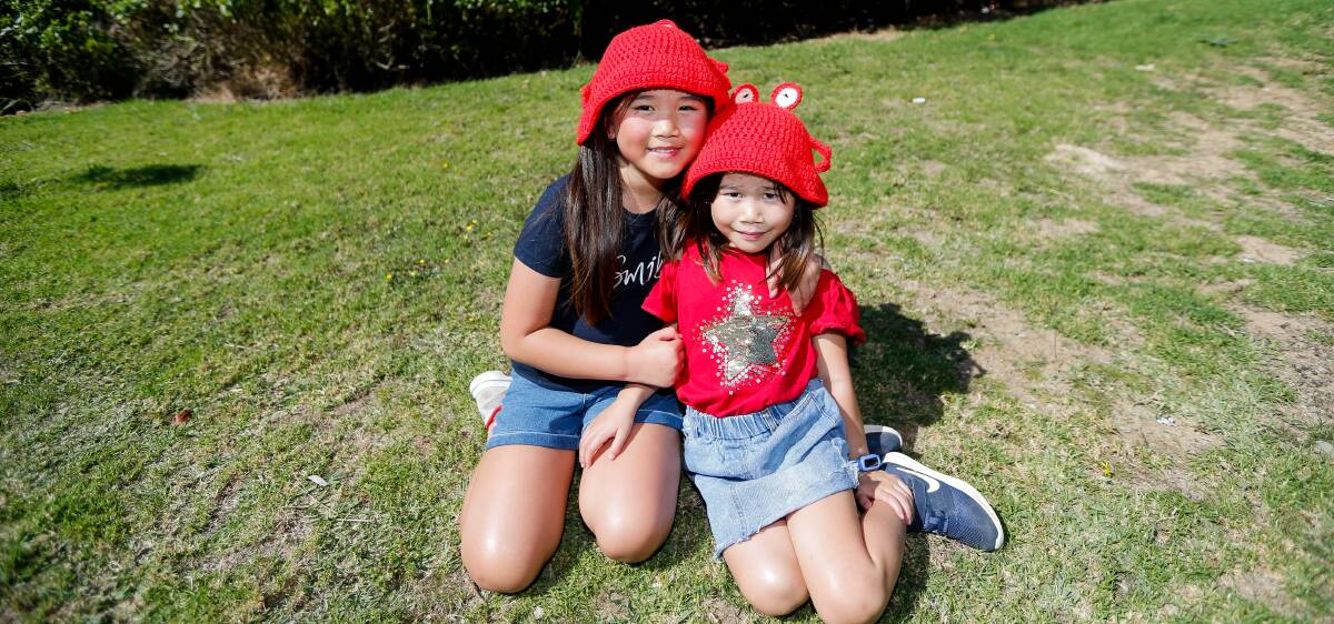 LOBSTER LOVE: Nikayla and Natasha Oto-Muliawan donned crayfish hats in celebration of Crayfest. Picture: Anthony Brady