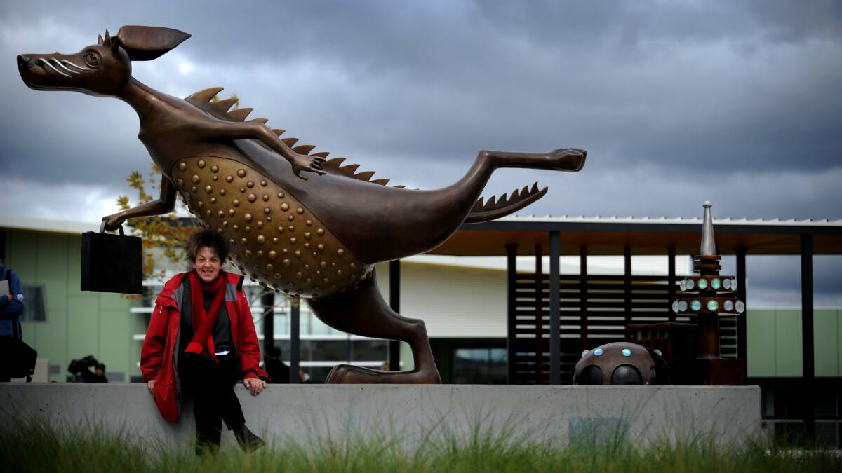 Bunyip statue in Canberra with artist Anne Ross. Picture by Marina Neil.