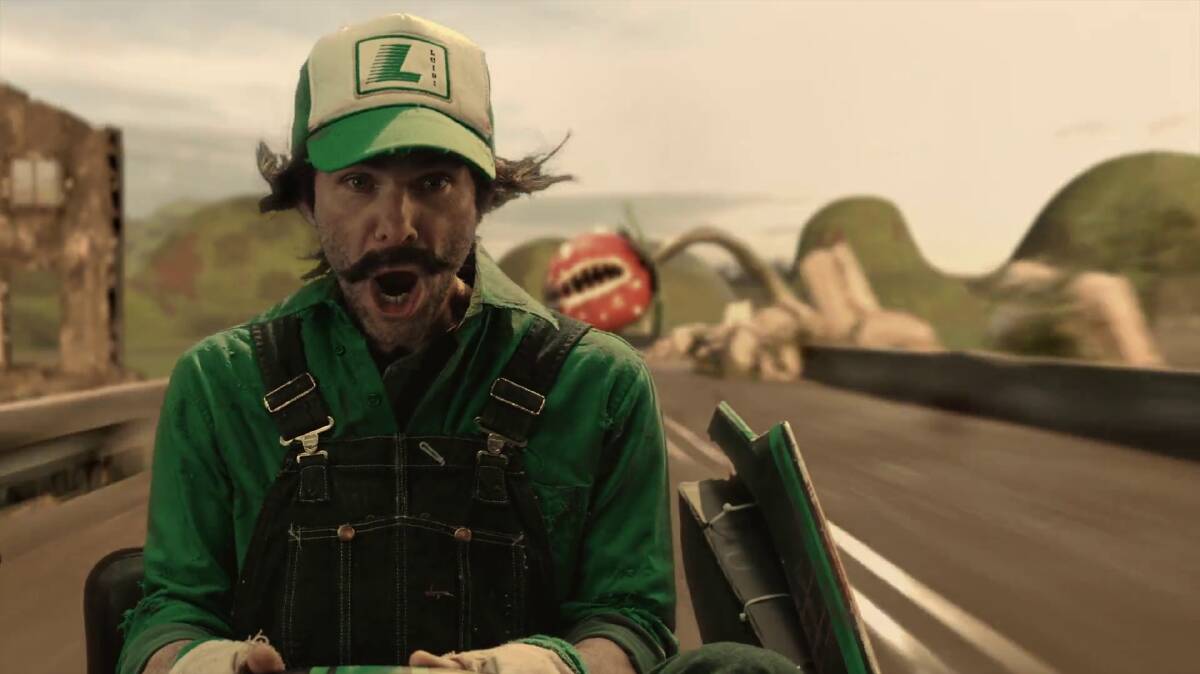 Luigi (Mikey Day) dodges a giant Piranha Plant on Rainbow Road. (Image: Saturday Night Live)