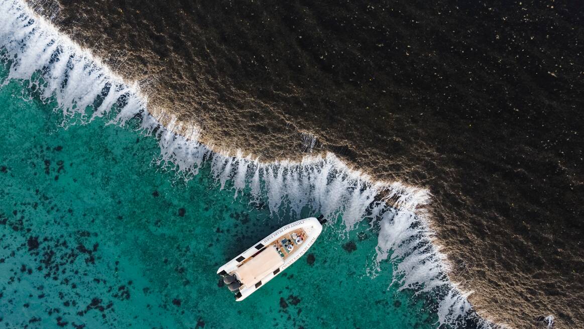 Tour boat at Western Australia's coral waterfall. Picture via Cygnet Bay Pearl Farm