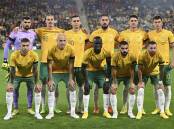 The Socceroos pose for a photo before the start of a friendly soccer international between Australia and New Zealand in Brisbane in September 2022. Picture by AP Photo/Dan Peled